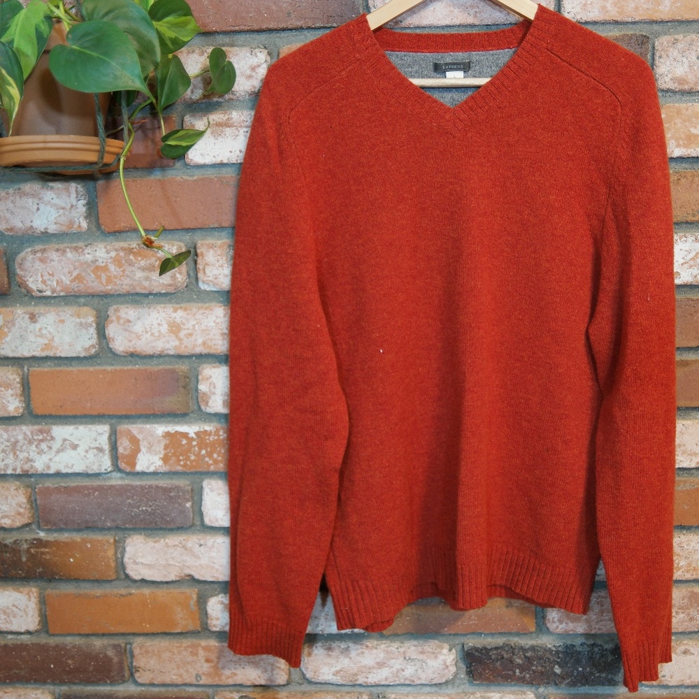 red-ish wool sweater